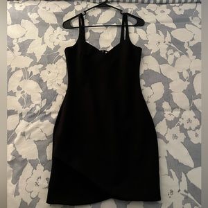 Revolve black bodycon dress with sweetheart neckline, brand is likely.